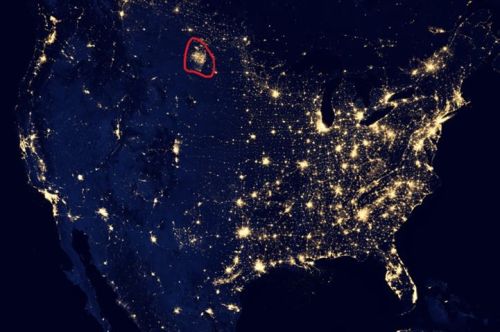 Hell? or North Dakota? This satellite photos shows the magnitude of oil development in the Bakken field (outlined in red) previously one of the the Lower 48's most sparsely inhabited places. The lights you see are not towns but flares from oil wells. Projections suggest this development will triple? quadruple? or more.